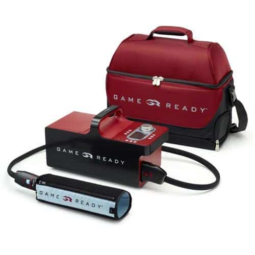 The Game Ready GRPro 2.1 control unit connected to a wrap, with its red carry bag